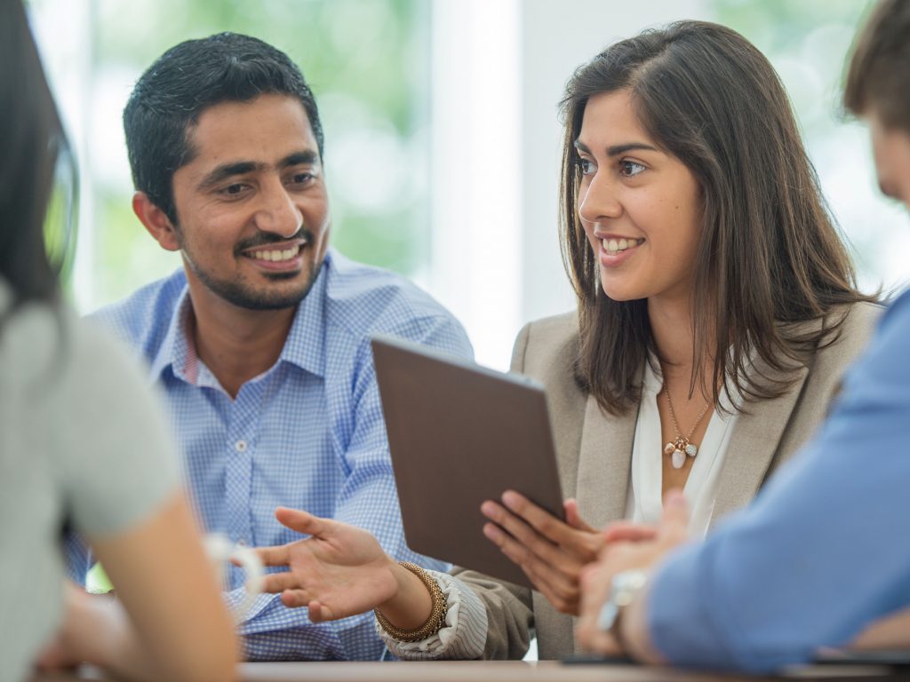 Employees discussing strategies.